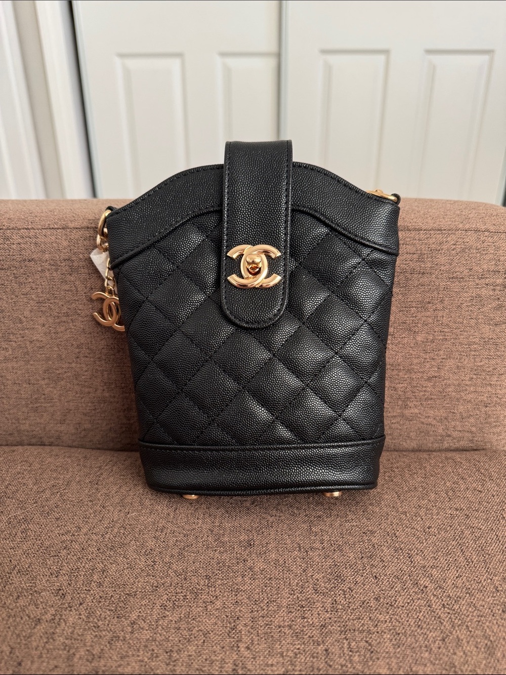 CHANEL Black Quilted Mini Bucket Bag with Gold CC